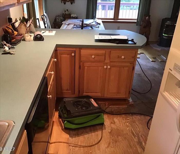 water damaged kitchen and flooring