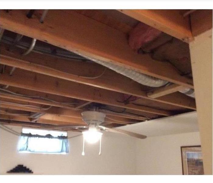 demolished ceiling, fan in bedroom