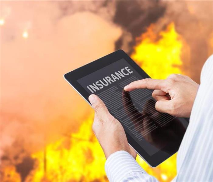 INSURANCE PAD WITH A FLAME IN BACKGROUND